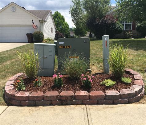 fencing to hide electrical box in yard|landscaping to hide utility box.